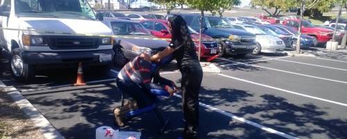 Megan giving a massage at CoreLogic Wellness Expo