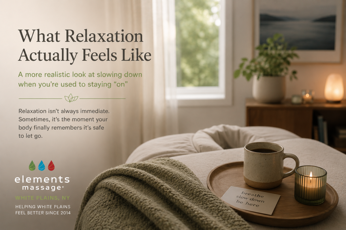 Editorial wellness image for an Elements Massage White Plains article about relaxation and recovery. A quiet living space with a chair, blanket, mug, and soft natural light illustrates how slowing down often happens gradually, especially for people who ar
